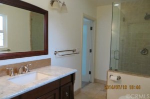 The master is more recently updated, but too small, has a single sink vanity and not enough storage. 